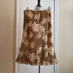 Sassy floral skirt in tan & cream with black accents.
